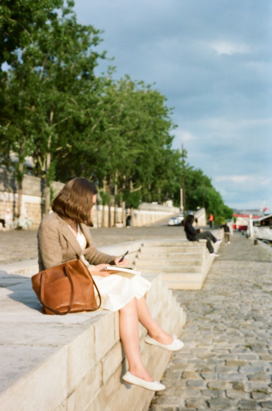Jocelyn sketching along the Seine in Paris